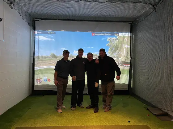 The second place team of the Super Bowl Shoot-Out in the simulator bay