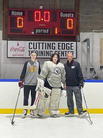 Tyler Robertson, goalie Jack Falk and Michael Silengo on the ice