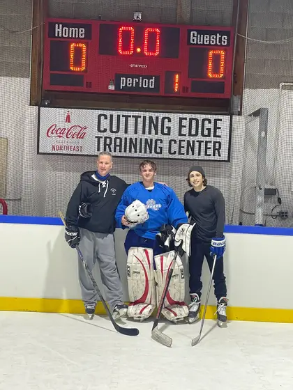 Michael Silengo, goalie Aaron McLeod and Paul Falanga on the ice