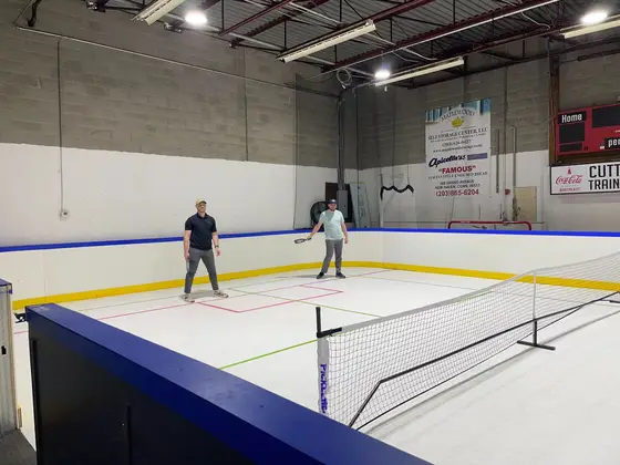 Pickleball players at the net