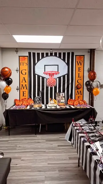A birthday boy with balloons and a man on the court